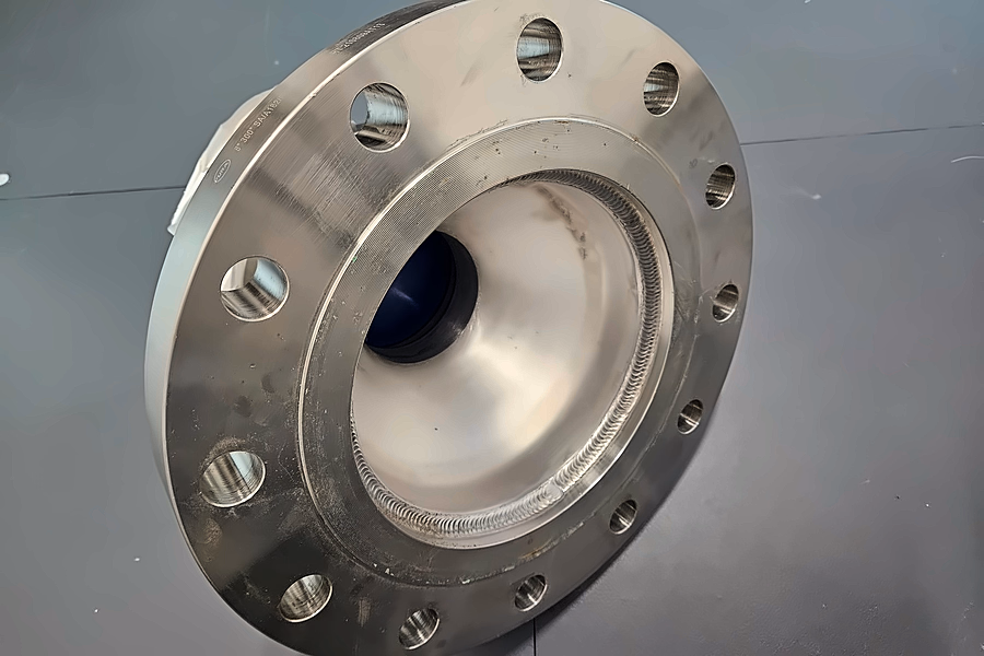 A machined stainless steel pipe flange